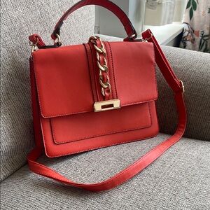 Aldo Red Satchel with Gold Hardware and Flap Design
